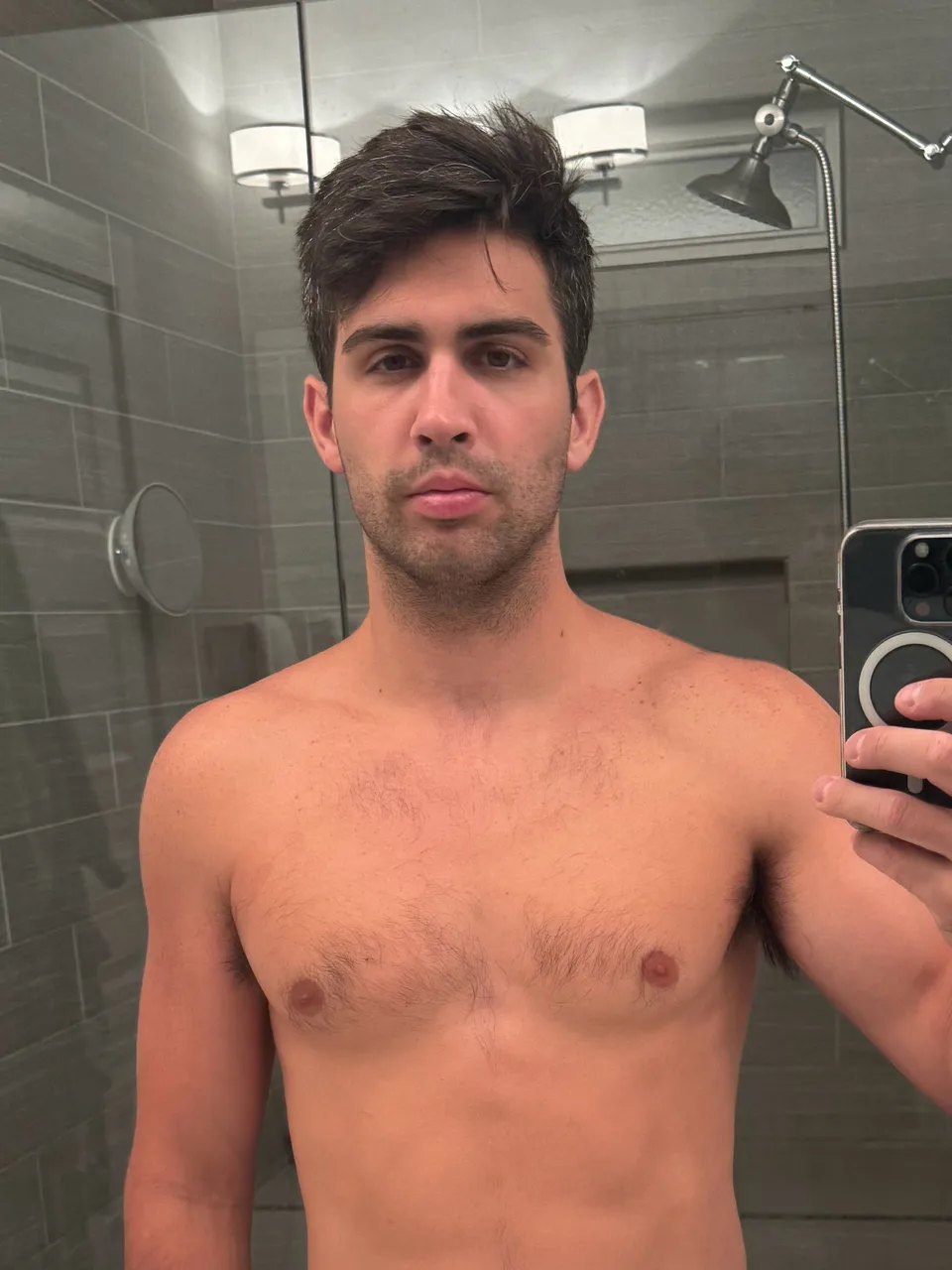 Thomas shirtless taking a bathroom mirror selfie on day 1 of 75 Hard